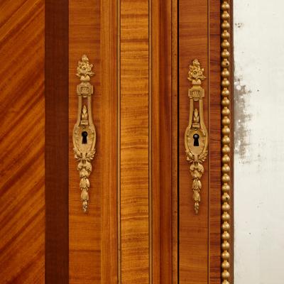  Au Gros Ch ne Large Parisian wardrobe adorned with marquetry and gilt bronze