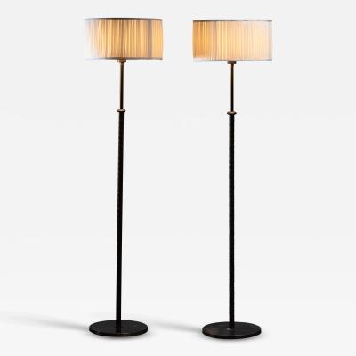  B hlmarks AB Bohlmarks Bohlmarks pair of brass and leather floor lamps