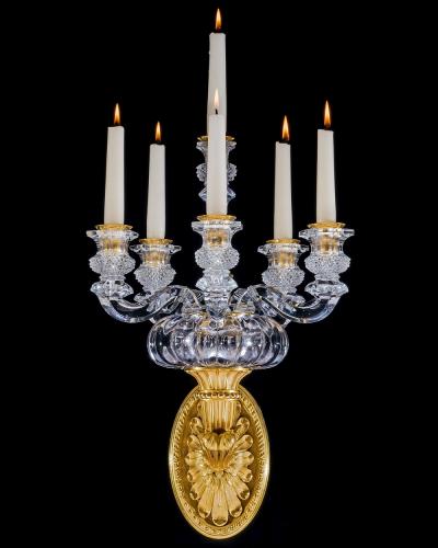  Baccarat A PAIR OF ORMOLU AND CRYSTAL EMPIRE WALL LIGHTS ATTRIBUTED TO BACCARAT