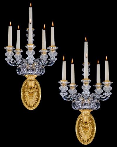  Baccarat A PAIR OF ORMOLU AND CRYSTAL EMPIRE WALL LIGHTS ATTRIBUTED TO BACCARAT