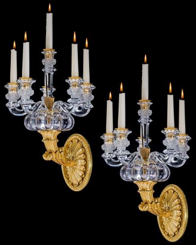  Baccarat A PAIR OF ORMOLU AND CRYSTAL EMPIRE WALL LIGHTS ATTRIBUTED TO BACCARAT