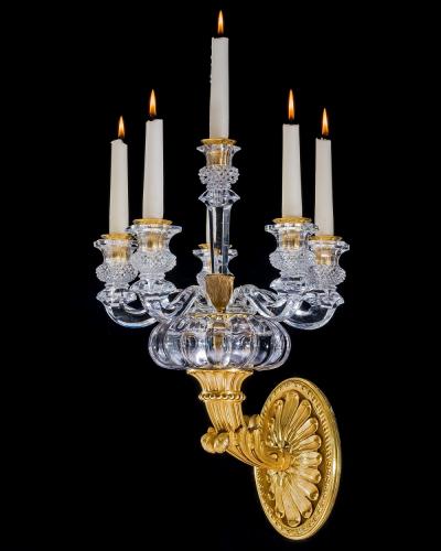  Baccarat A PAIR OF ORMOLU AND CRYSTAL EMPIRE WALL LIGHTS ATTRIBUTED TO BACCARAT