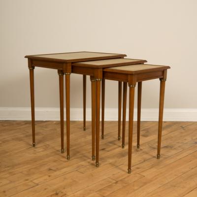  COMTE A nest of three mahogany tables attributed to Comte Circa 1940
