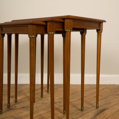  COMTE A nest of three mahogany tables attributed to Comte Circa 1940