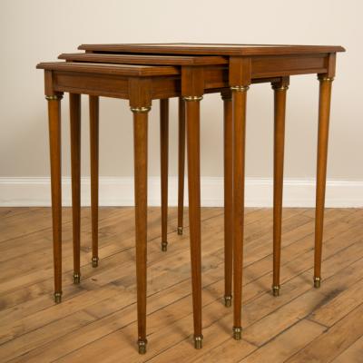  COMTE A nest of three mahogany tables attributed to Comte Circa 1940