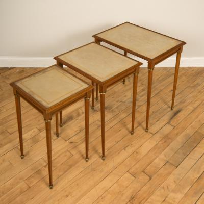  COMTE A nest of three mahogany tables attributed to Comte Circa 1940