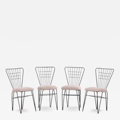  COMTE A set of four iron and bronze side chairs attributed to Comte C 1950 