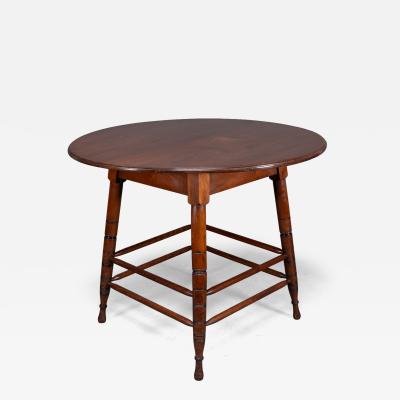  Collinson Lock Aesthetic Movement Walnut centre table with incised circular details to the legs