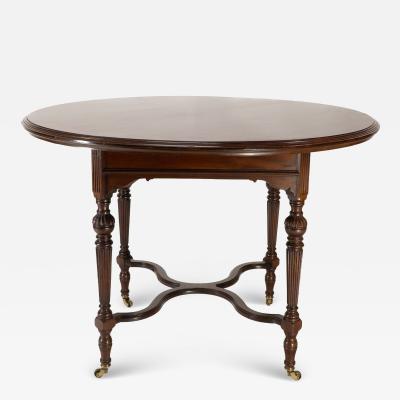  Collinson Lock Collinson Lock attributed An Aesthetic Movement walnut circular center table