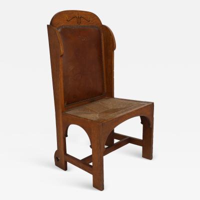  E G Punnett E G Punnett attributed Probably Made by William Birch An Oak Wing Back Chair