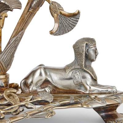  Elkington Co A parcel gilt and electroplated epergnes suite by Elkington Co 