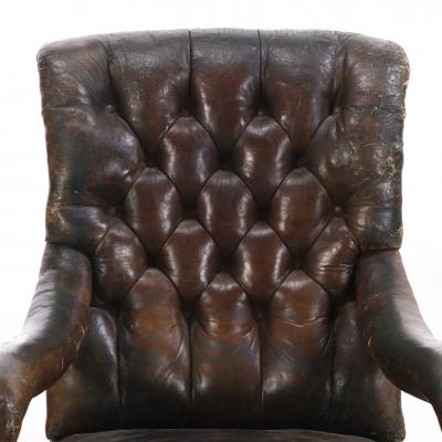  Gillows of Lancaster London An English Walnut and Tufted Leather Library Armchair by Gillows 19th C 