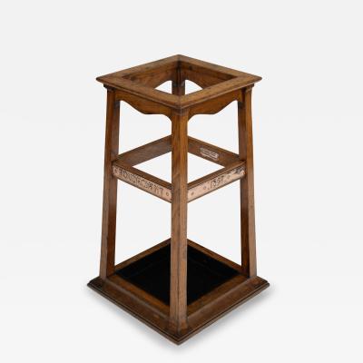  Goodall Lamb Heighway Ltd Manchester A Foudroyant oak and copper umbrella stand by Goodall Lamb Heighway