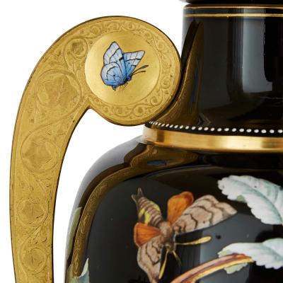  Gr flich Schaffgotsch sche Josephinenh tte A three piece Bohemian enamelled black glass vase garniture set