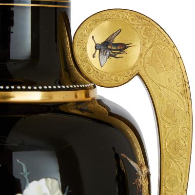  Gr flich Schaffgotsch sche Josephinenh tte A three piece Bohemian enamelled black glass vase garniture set