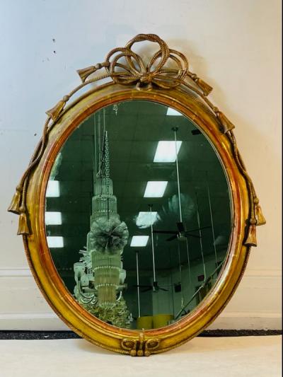  Grosfeld House EXCEPTIONAL CARVED GOLD LEAF ROPE AND TASSEL OVAL MIRROR