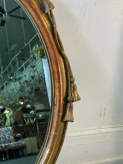  Grosfeld House EXCEPTIONAL CARVED GOLD LEAF ROPE AND TASSEL OVAL MIRROR