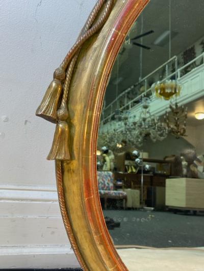  Grosfeld House EXCEPTIONAL CARVED GOLD LEAF ROPE AND TASSEL OVAL MIRROR