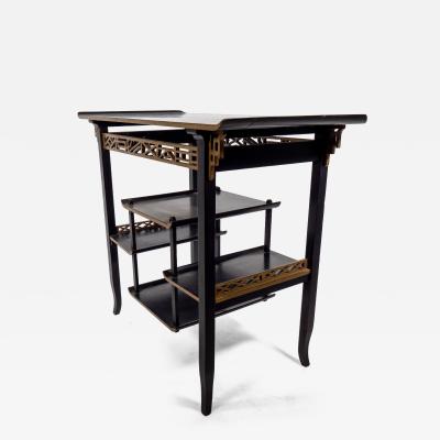  Heal s Heals Heal Son Ltd Heals An Anglo Japanese Ebonised Side Table with Gilt Fretwork Flaring Ends