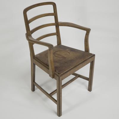 Heal s Heals Heal Son Ltd Heals attr A walnut desk chair or armchair with a rounded top and ladder back