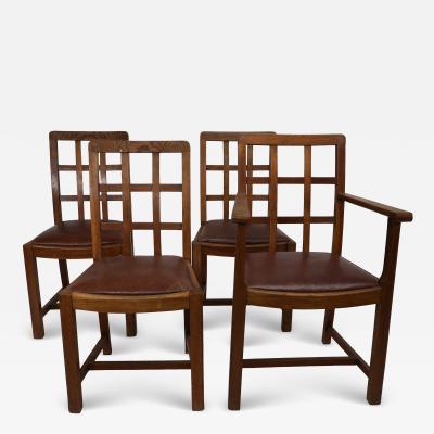  Heal s Heals Heal Son Ltd Heals of London attri A set of four Arts and Crafts Lattice back oak armchairs