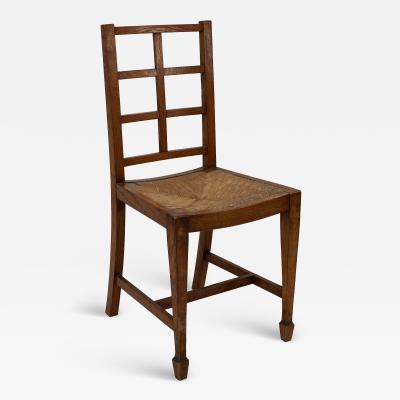  Heal s Heals Heal Son Ltd Heals of London attributed An Arts Crafts Oak Lattice Back Side Chair