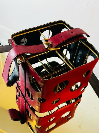  Herm s MODERNIST FRENCH RED PLEATHER AND BRASS WINE HOLDER IN THE STYLE OF HERMES
