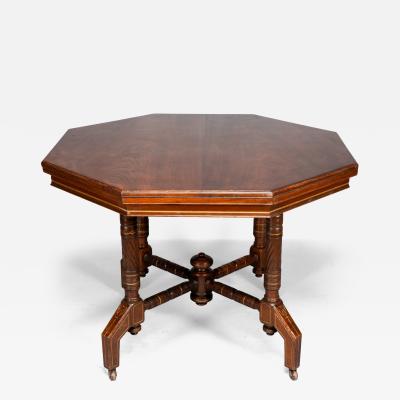  Hewetson Thexton An Aesthetic Movement Walnut Gilt Octagonal Centre Table