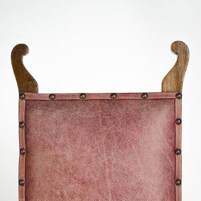  J S Henry J S Henry An ash Arts Crafts armchair with an elongated back curled ears