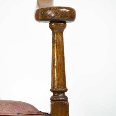  J S Henry J S Henry An ash Arts Crafts armchair with an elongated back curled ears