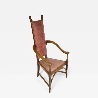  J S Henry J S Henry An ash Arts Crafts armchair with an elongated back curled ears