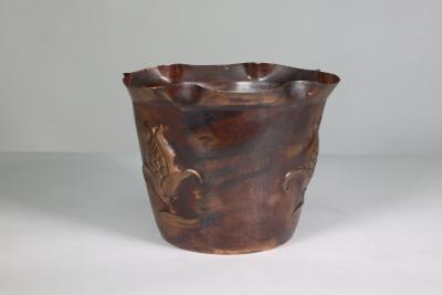  Joseph Sankey Sons Joseph Sankey Sons An Arts Crafts copper planter with embossed flower pod