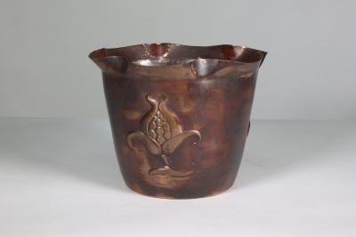  Joseph Sankey Sons Joseph Sankey Sons An Arts Crafts copper planter with embossed flower pod