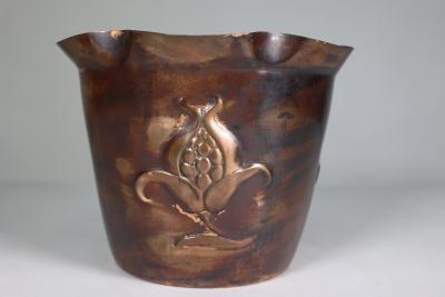  Joseph Sankey Sons Joseph Sankey Sons An Arts Crafts copper planter with embossed flower pod