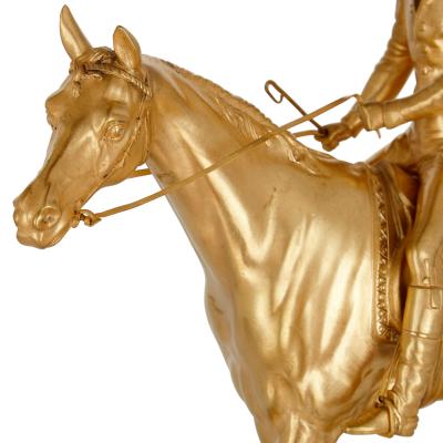  L Leroy Cie Charles X Style ormolu and malachite mantel clock with horse and jockey