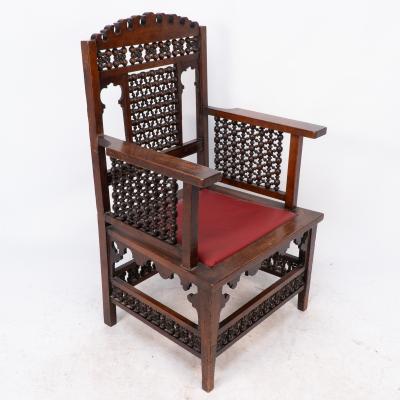 Liberty Co Liberty Co A Moorish walnut armchair with Mashrabiya turned details throughout