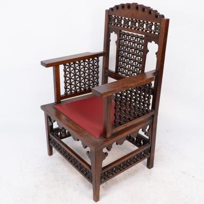 Liberty Co Liberty Co A Moorish walnut armchair with Mashrabiya turned details throughout