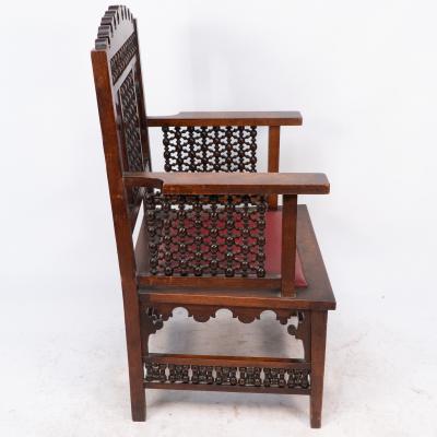 Liberty Co Liberty Co A Moorish walnut armchair with Mashrabiya turned details throughout