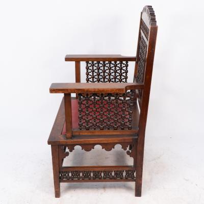 Liberty Co Liberty Co A Moorish walnut armchair with Mashrabiya turned details throughout