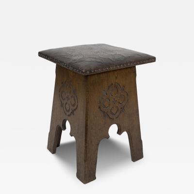  Liberty Co Liberty Co An Arts Crafts Moorish Oak Stool with Embossed Leather Seat