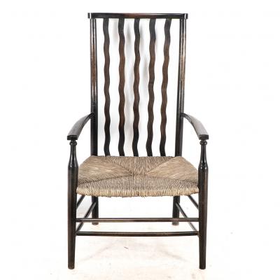  Liberty Co Liberty Co An Arts Crafts Rush Seat Armchair with Wavy Shaped Back Slats