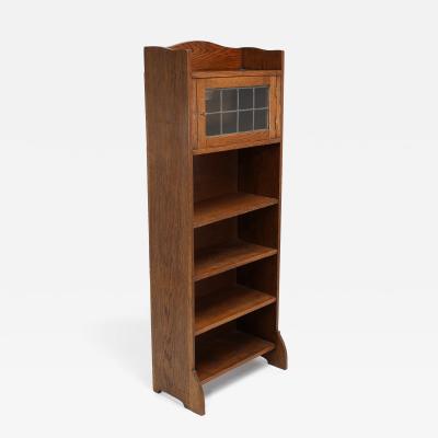  Liberty Co Liberty Co An English Arts Crafts Oak Bookcase with Shaped Upper Details