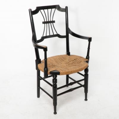Liberty Co Liberty Co an English Aesthetic Movement Ebonised Armchair with Seagrass Seat