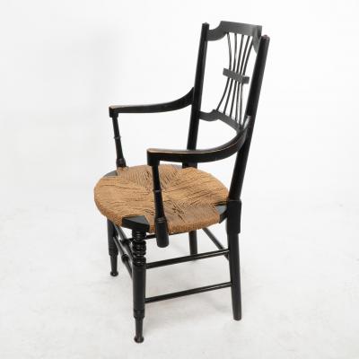 Liberty Co Liberty Co an English Aesthetic Movement Ebonised Armchair with Seagrass Seat