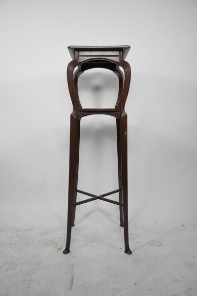  Liberty Co Liberty Co attr A Tall Arts Crafts Walnut torchere with an Art Nouveau style