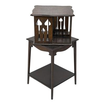 Liberty Co Liberty and Co An oak revolving bookcase with stylized floral cut out decoration