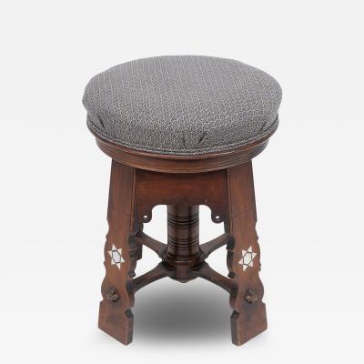  Liberty Co Liberty and Co attri A rare Moorish walnut revolving stool with Moorish arches