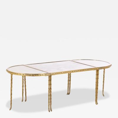  Maison Bagu s A French three part gilt bronze coffee table attributed to Bagues C 1960 
