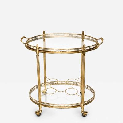  Maison Bagu s Mid century Maison Bagu s Brass Oval Bar Cart circa 1960