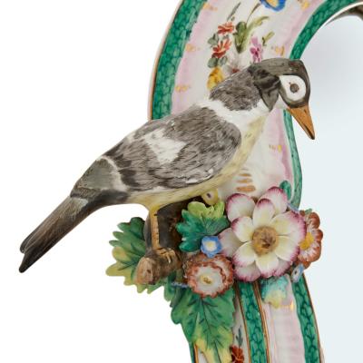  Meissen Porcelain Manufactory Pair of Meissen style porcelain and ebonised wood mirrored wall brackets